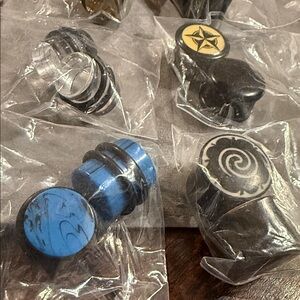 Assorted Black and Silver Plugs and Tunnels